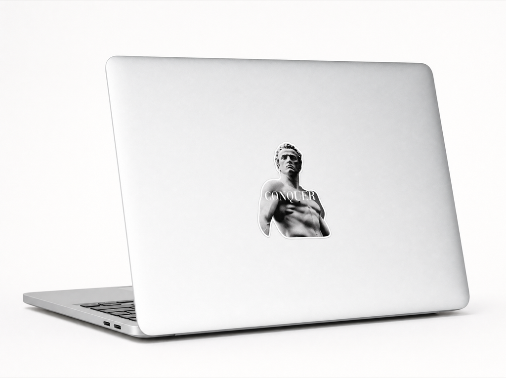 CONQUER sticker on laptop